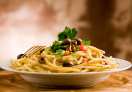 delicious pasta with olives and parsley
