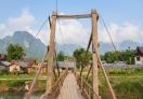 Wooden bridge connecting Vang Vieng town with Saysong island.
