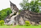 A huge statue of reclining Buddha in the park.