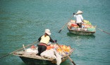 The local going boat to boat and selling goods