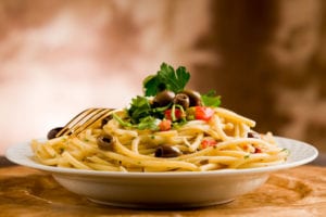 delicious pasta with olives and parsley